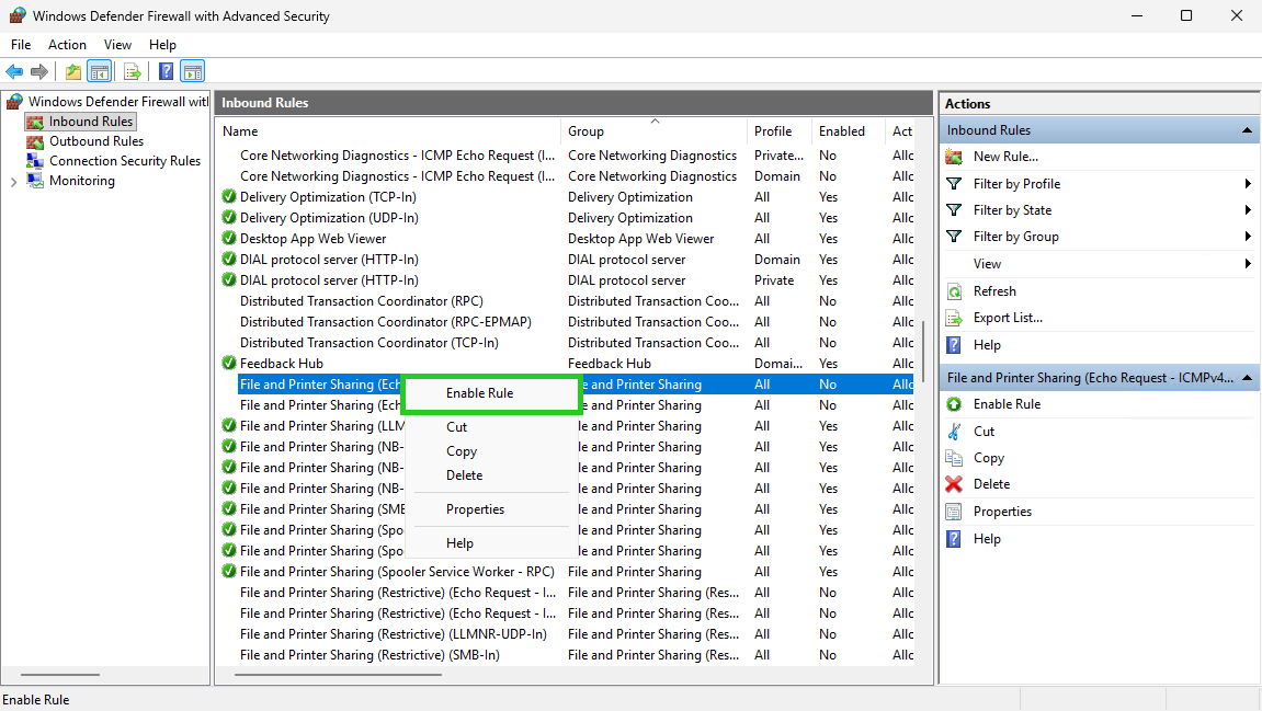 The Windows Defender Firewall with Advanced Security app with the Enable Rule option highlighted within the context menu.